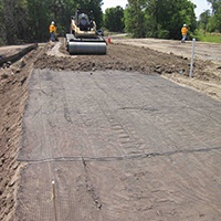 Reinforced steep soil slopes and embankments